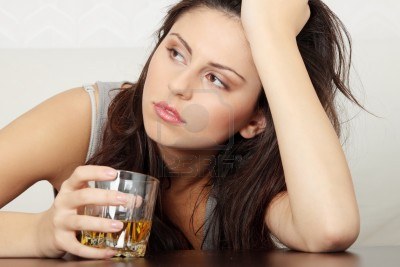 8830666-yound-beautiful-woman-in-depression-drinking-alcohol