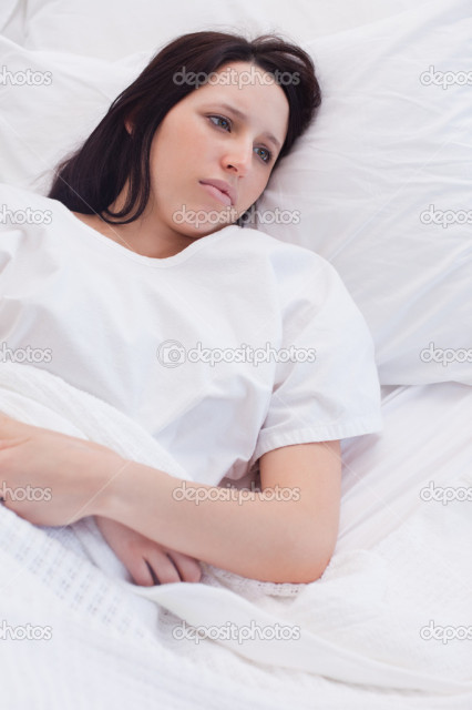 Sad woman laying in the hospital