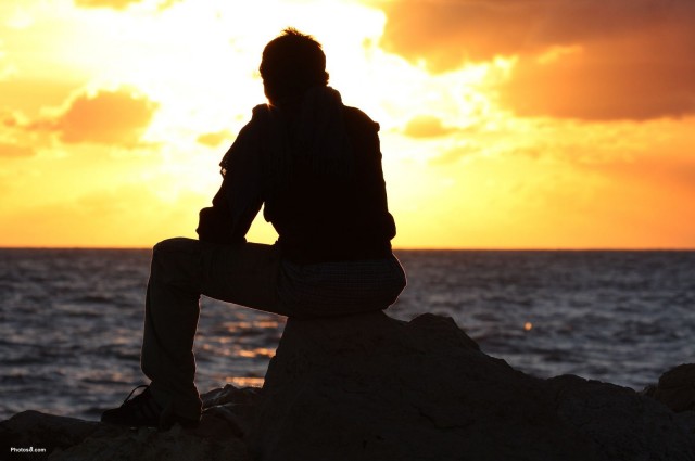 man_sitting_and_watching_sunset-other