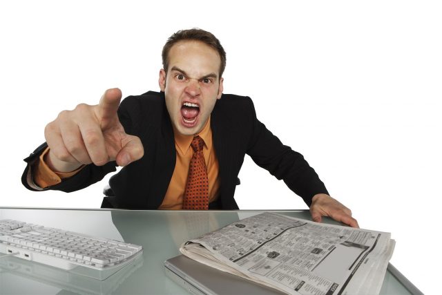 angry_pointing_business_man_at_desk_4q6a-Large