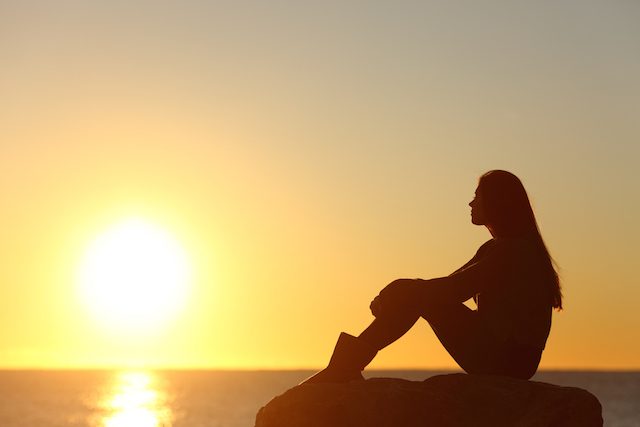 Woman-Sitting-Alone